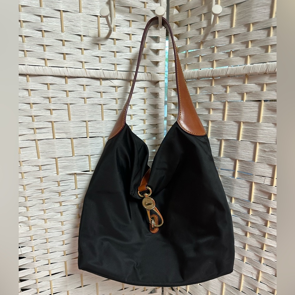 Dooney Bourke Nylon black bag with leather strap. Red interior. EUC